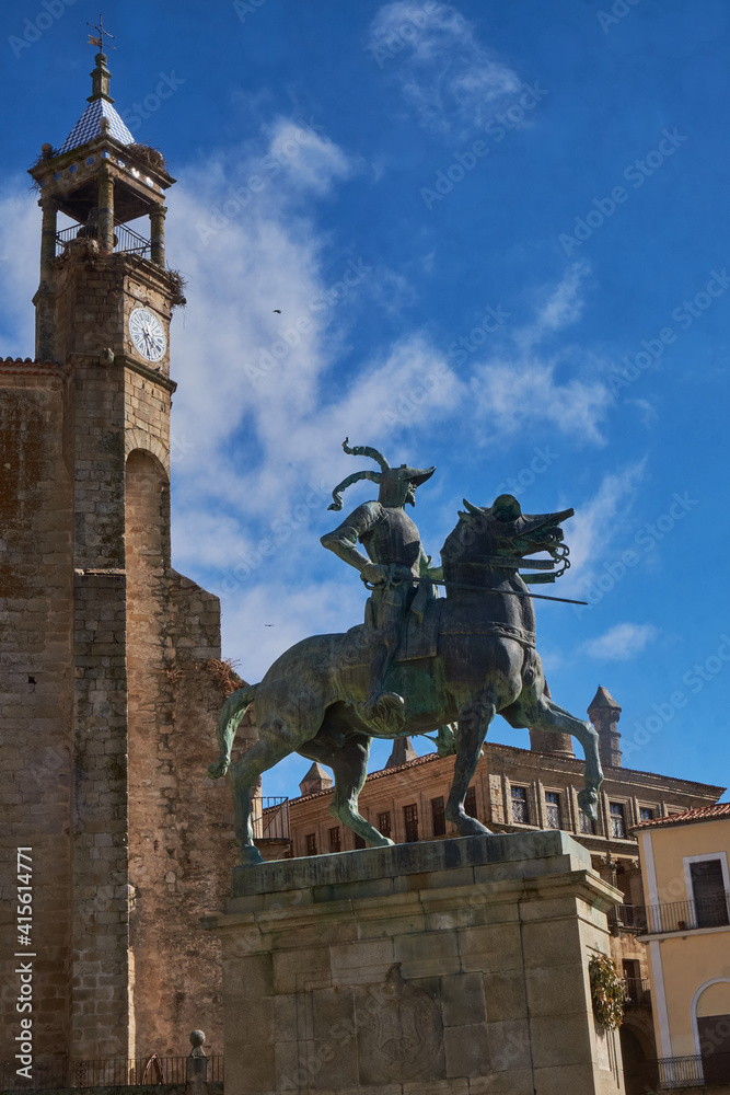 Equestrian statue of Francisco Pizarro in Plaza Mayor de Trujillo (Caceres). Work of the American sculptor Charles Casy Rumsey. In the background the Church of San Martin.