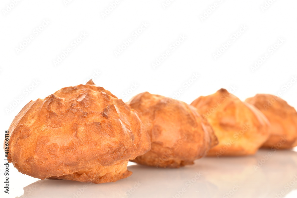 Several fresh fragrant chouquettes, on a white background. Several fresh fragrant chouquettes, on a white background.