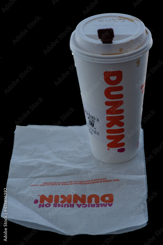 White paper Dunkin Donuts Coffee Cup on black background. Stock Photo |  Adobe Stock