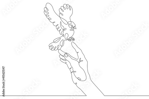Fototapeta Naklejka Na Ścianę i Meble -  The bird sits on the human hand. Bird flying in the air. Open palm. One continuous drawing line  logo single hand drawn art doodle isolated minimal illustration.
