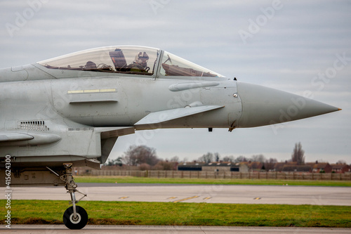 Fotografie RAF Typhoon Fighter Jet close up of the nose and cockpit with pilot wearing helmet and oxygen mask