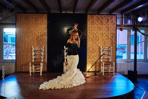 Spanish flamenco dancer on a traditional stage.