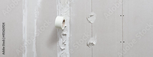 Fotografi drywall construction repair concept, procedure for leveling plasterboard walls w