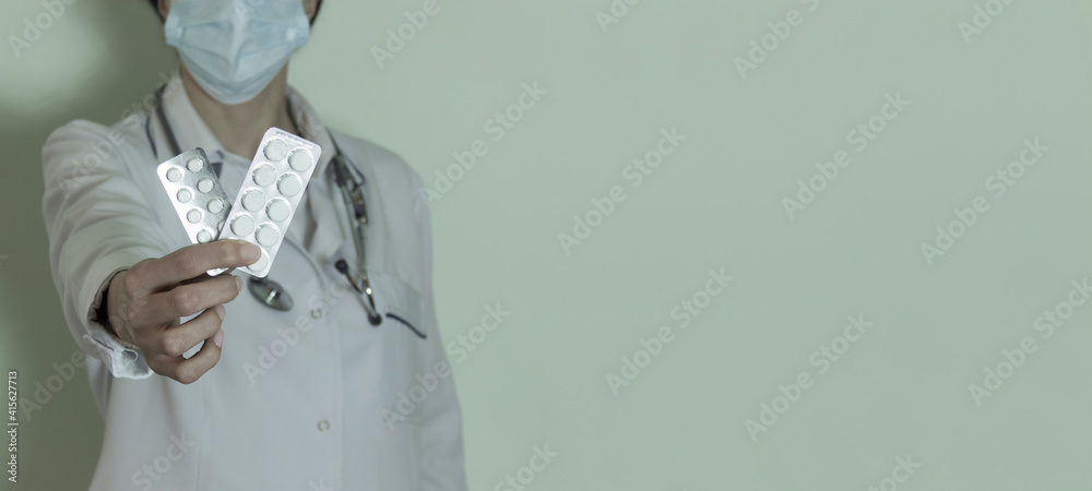 Close Up. Nurse Holding Pills. Nurse in a White Coat. Clinic. Medcines. Canvas of Pills. Medical Uniform. Pills for Rehabilitation. Lifesaver Stuff .