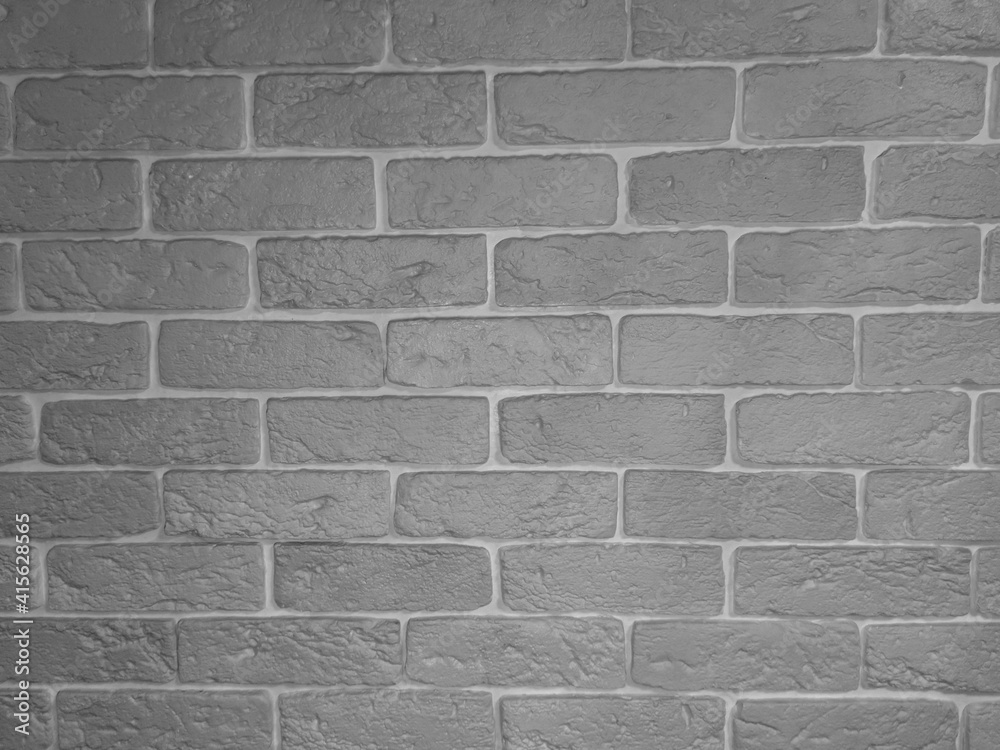 Obraz premium Black and white background image in the form of plaster bricks, photo background, with space for text