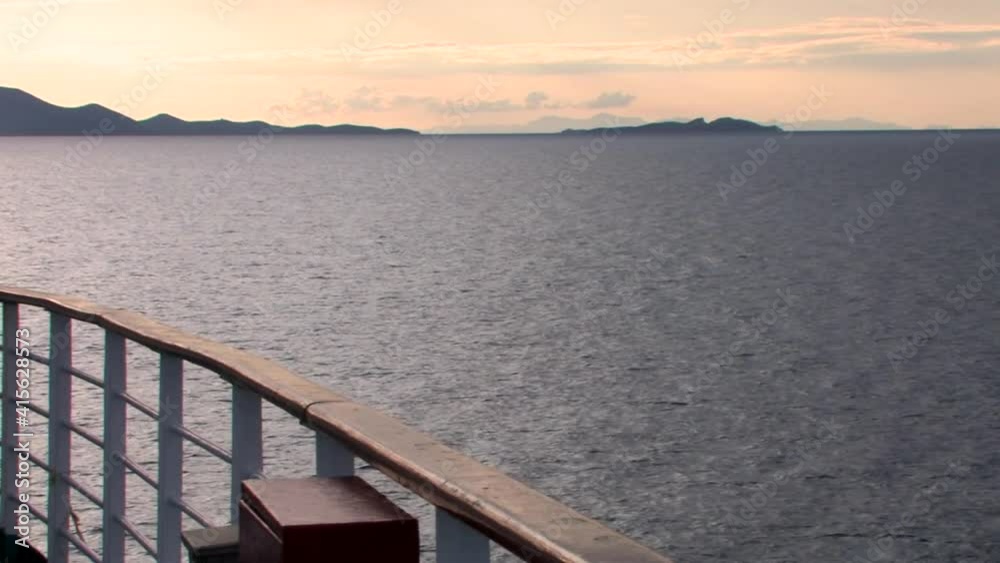arriving on the island of Patmos by boat with a calm sea arriving on the island of Patmos by boat with a calm sea