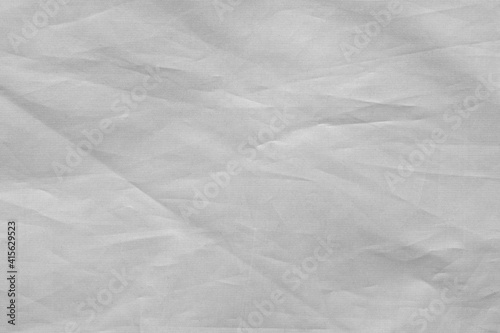 Texture of white fabric with small folds