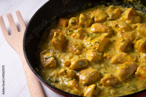 Chicken cooked with coconut milk and curry.