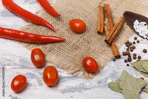 Red chili peppers, cherry tomatoes and bay leafs
