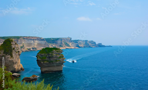 The limestone coastline of Bonifacio with Le Grain de Sable (U Diu Grossu) rock formation, Corsica, France photo