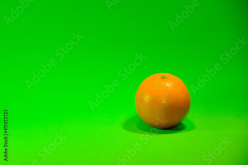 Oranges on a green background.