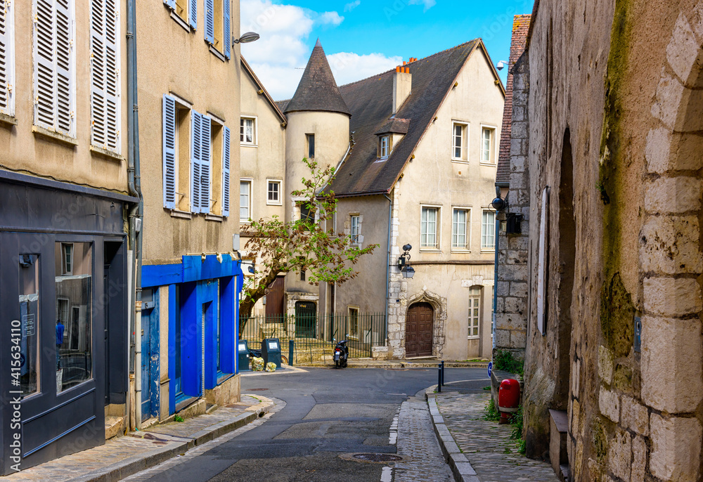 Old street with old houses in a small town Chartres, France