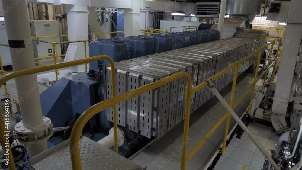 Close to four stroke diesel engine in engine room of ship