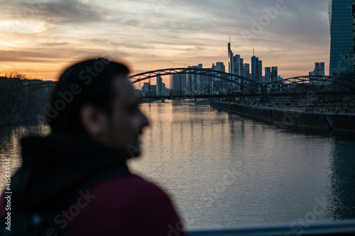 Yong stylish man enjoying a city view, taking a break and relaxing, active weekend walking, sightseeing 
