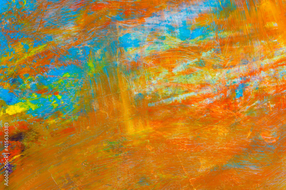 colorful creative motley background: smudged residues of oil paints on a wooden palette, short focus, selective blur
