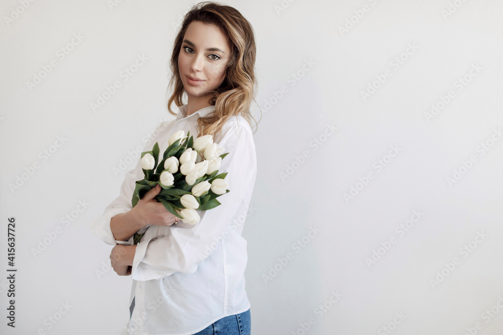 Young pretty woman with tulips flowers bouquet, Spring calm and happy portrait Young pretty woman with tulips flowers bouquet, Spring calm and happy portrait
