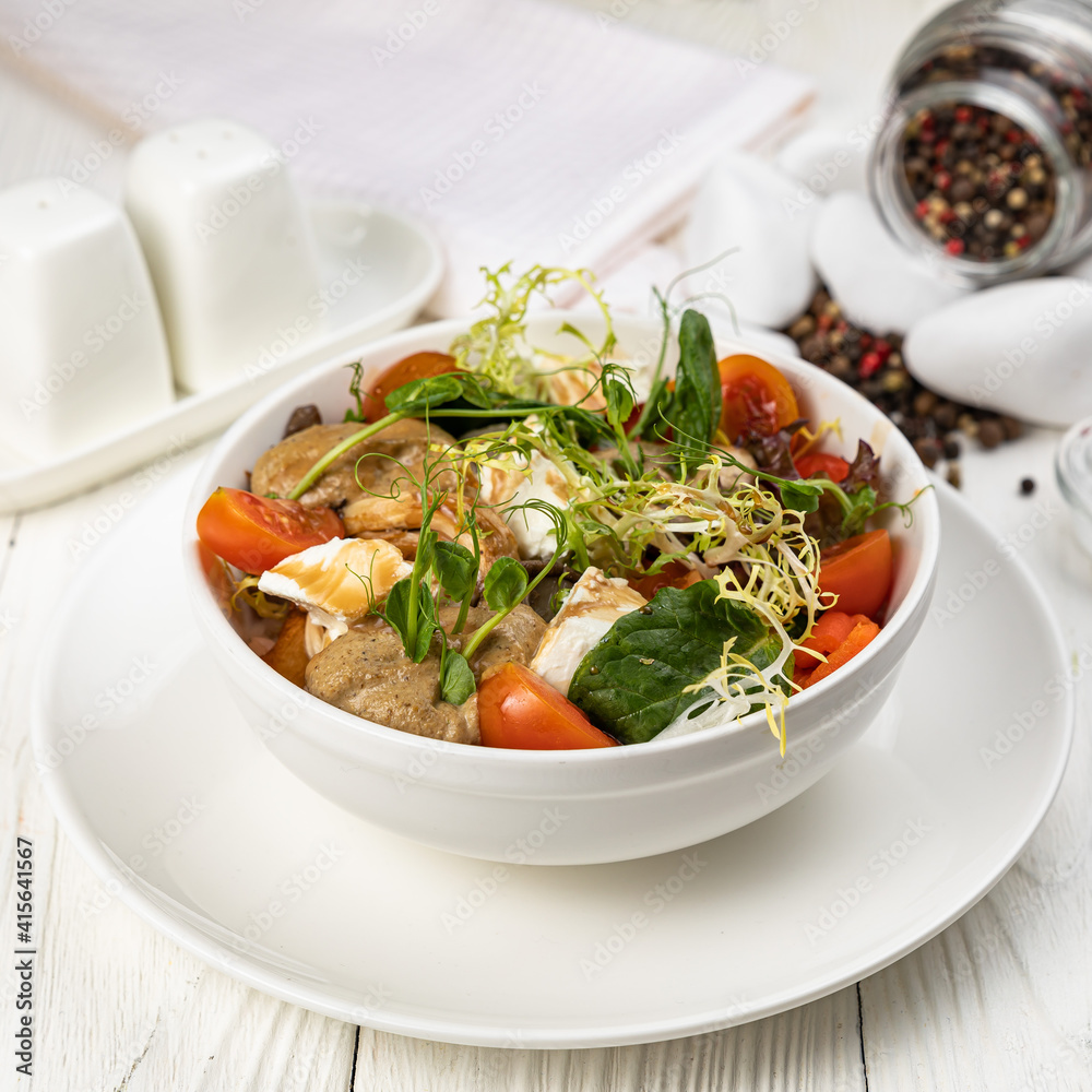 Cheese salad on a white wooden table
Cheese salad on a white wooden table