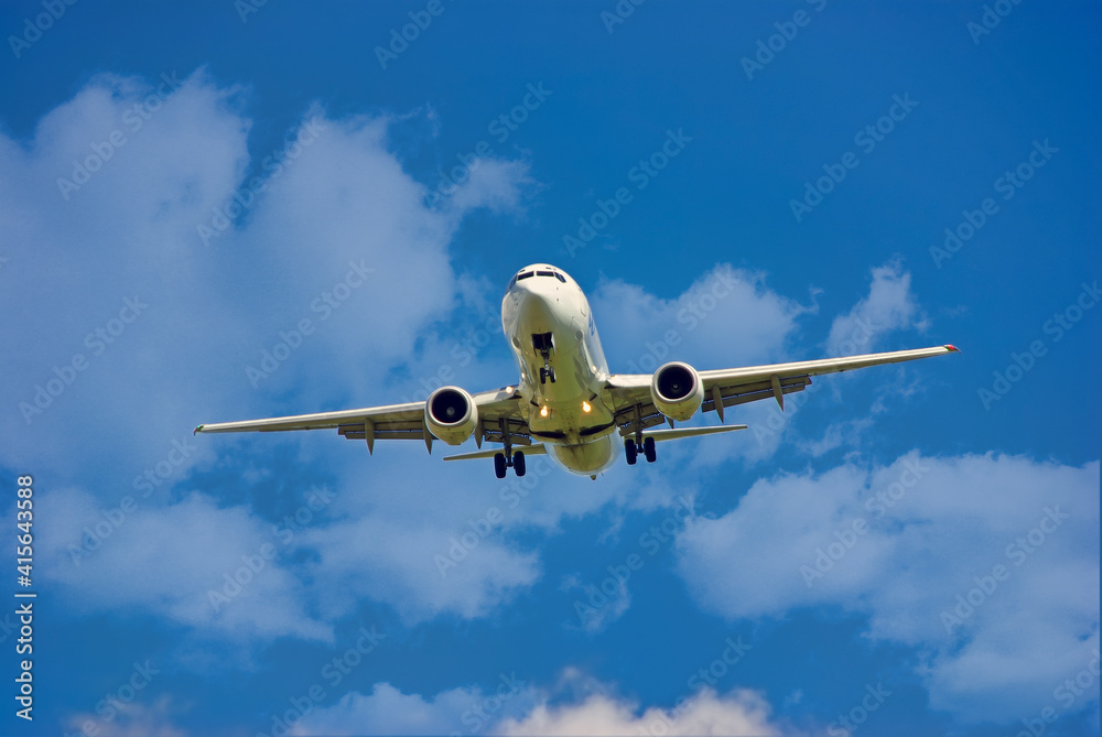 White Airplane initiating landing White Airplane initiating landing