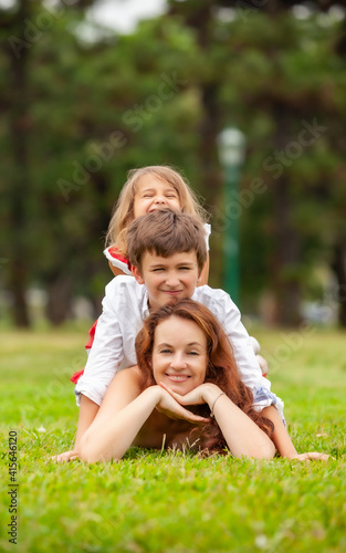 happy mother with children in the park outdoors