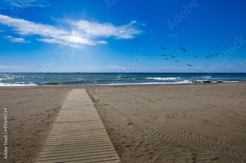 Wooden path in the sand