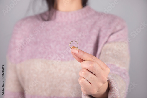 woman holding married ring