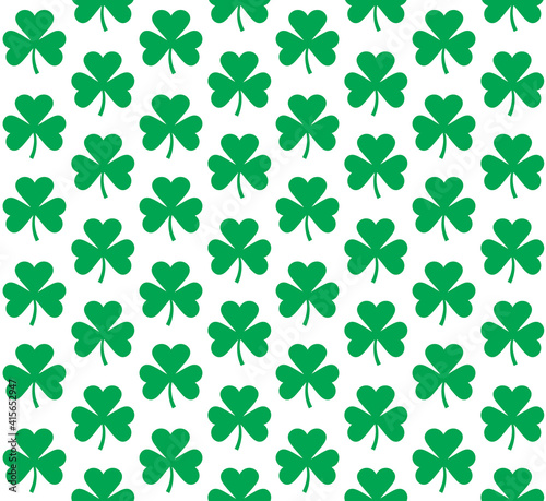 Vector seamless pattern of flat green shamrock clover isolated on white background
