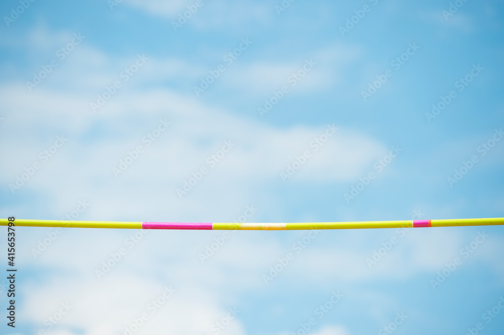 Hight jump competition crossbars on sky background. Athletic sport track in professional stadium Hight jump competition crossbars on sky background. Athletic sport track in professional stadium