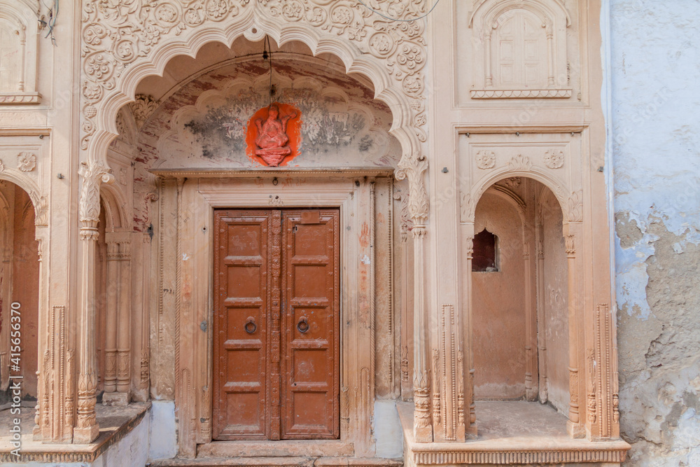 VRINDAVAN, INDIA - FEBRUARY 18, 2017: Ornate door of a house in Vrindavan, Uttar Pradesh state, India