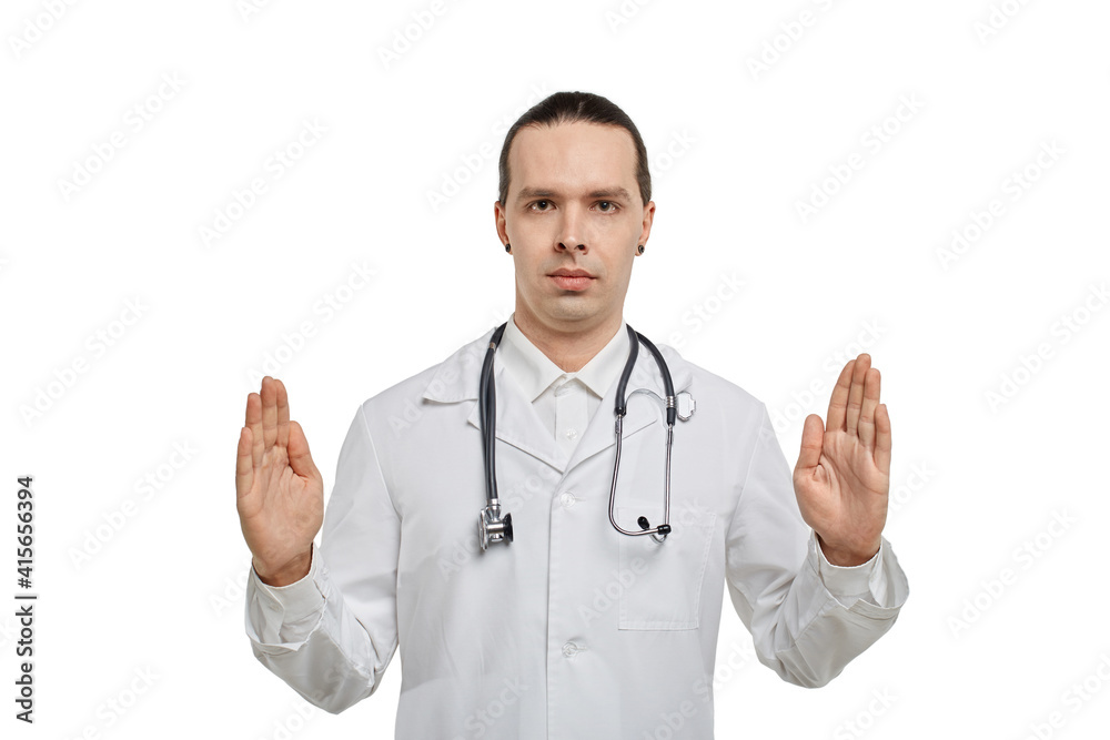 The doctor holds an invisible object in his hands, his hands are spread out to the sides. The concept of advertising. The doctor holds an invisible object in his hands, his hands are spread out to the sides. The concept of advertising.