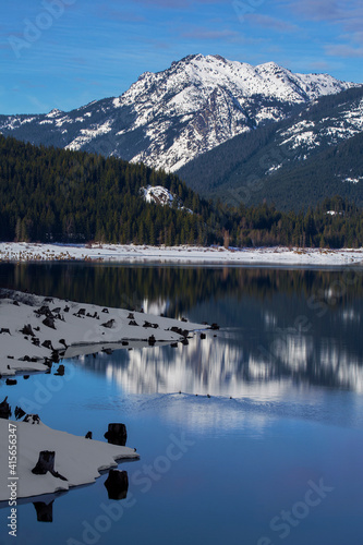 Beautiful snow-capped mountain reflections in Lake Keechelus in winter in Washington state
 photo