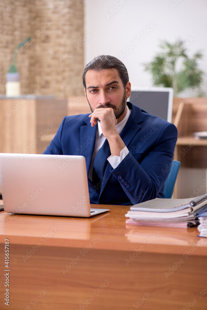 Young businessman employee working at workplace Young businessman employee working at workplace