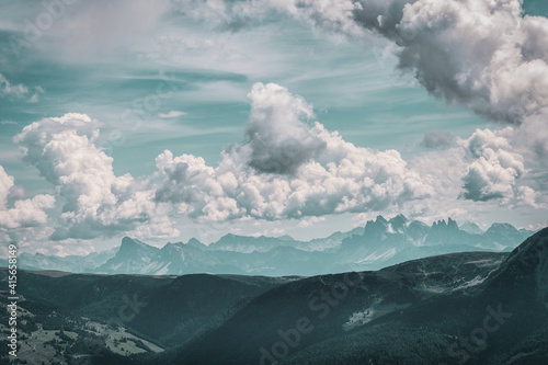 panoramic view of the Dolomites with beautiful weather clouds , Italy.