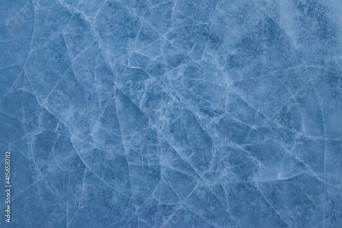 Texture of the cracked ice. Winter background © olyasolodenko