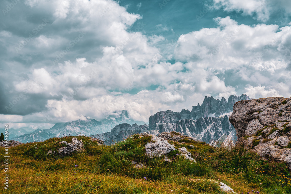 panoramic view of the Dolomites with beautiful weather clouds , Italy.