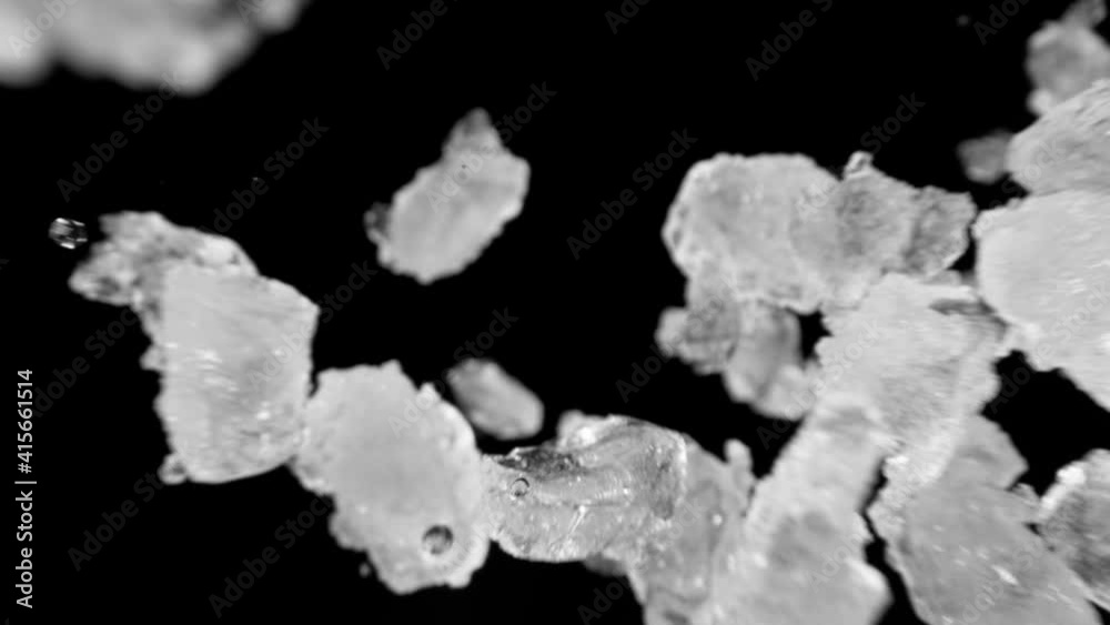 Super slow motion of falling ice cubes isolated on black background. Filmed on high speed cinema camera, 1000 fps. Super slow motion of falling ice cubes isolated on black background. Filmed on high speed cinema camera, 1000 fps.