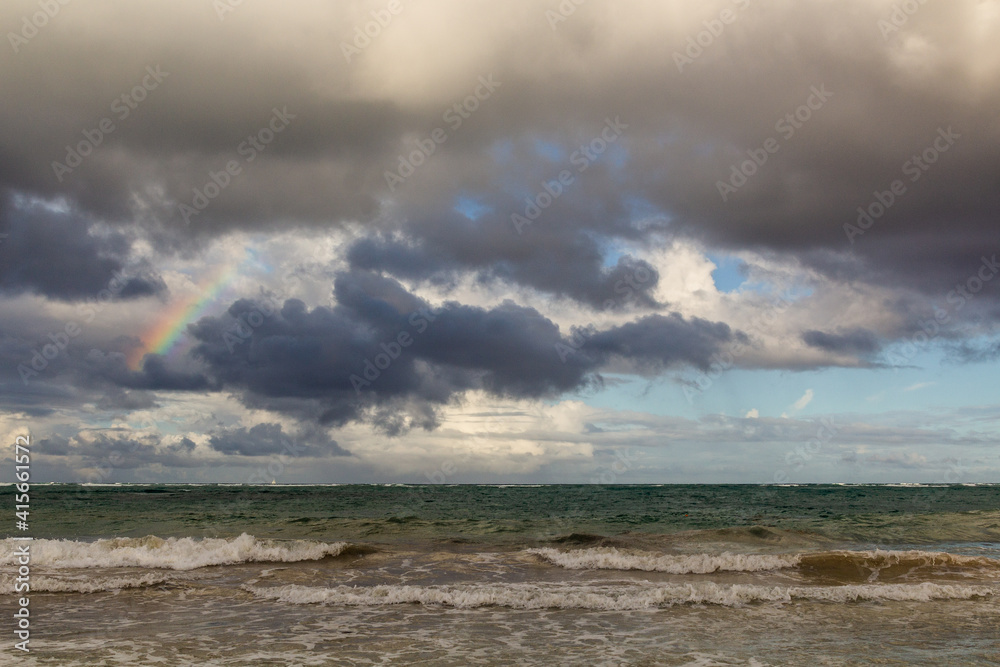 Rainbow and clouds at a sea