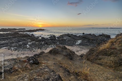 Sunset seen from a rocky beach