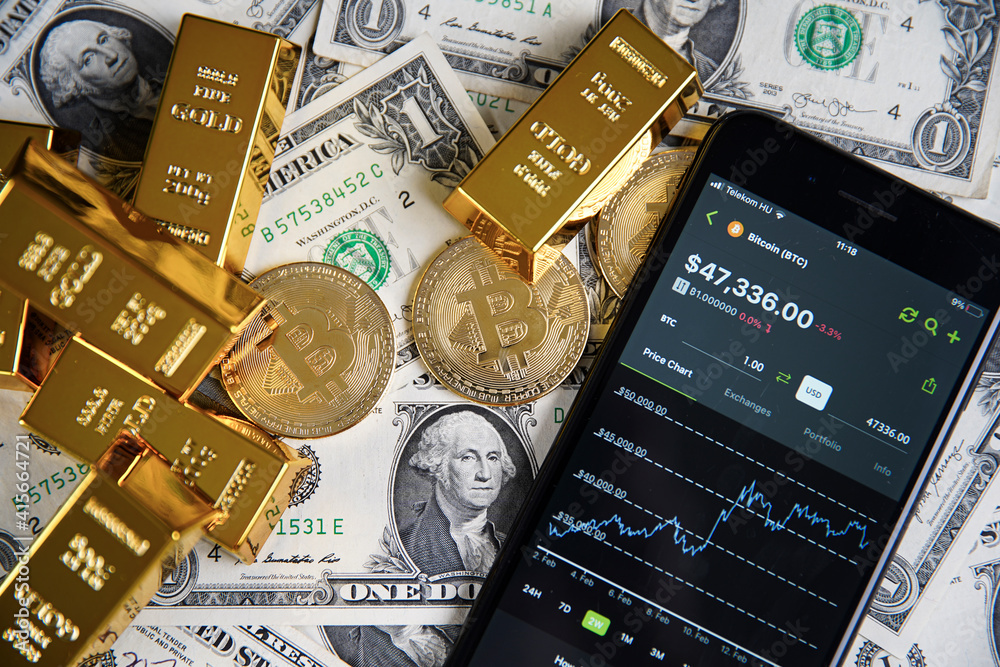 Smartphone application. CoinGecko logo on phone screen close up. On the table in the background American money, bitcoin and shiny gold bars. Budapest, Hungary - February 10, 2021