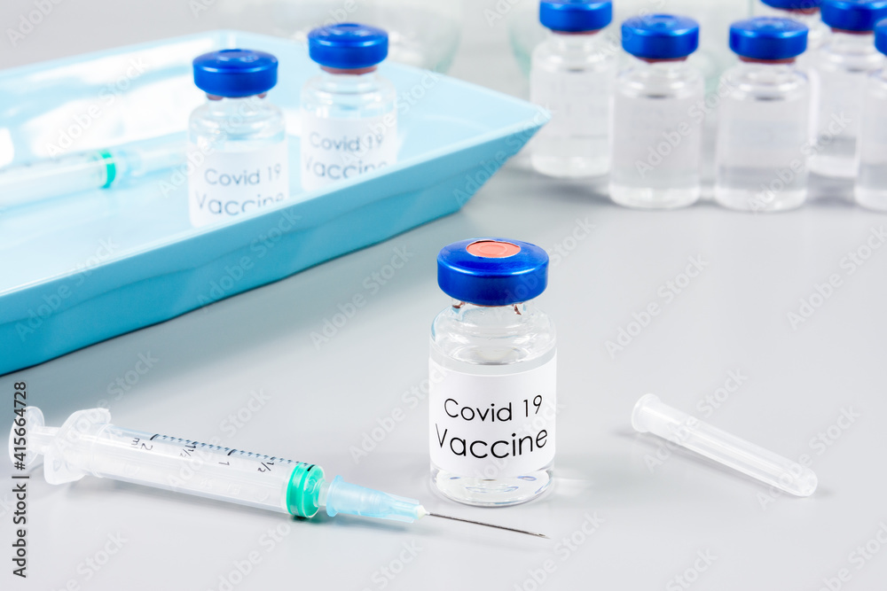 Vials of Covid-19 vaccine and syringe