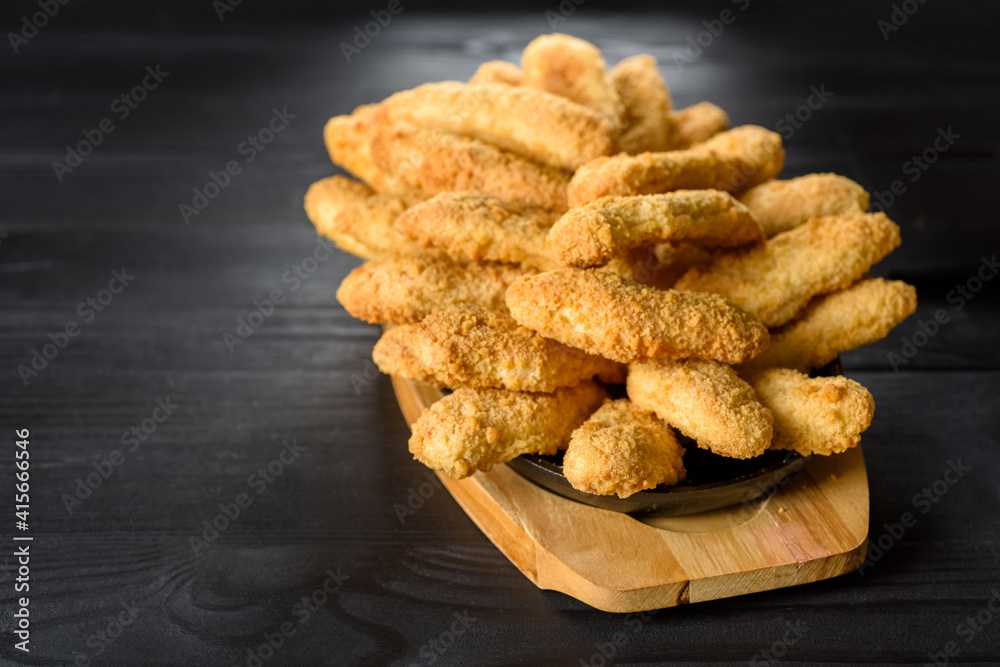 Naklejka premium baked chicken tenderloin in breadcrumbs