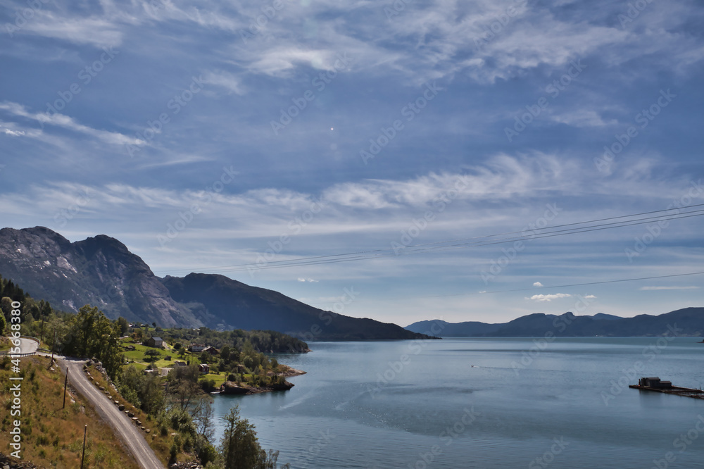 Obraz premium Horizontal view of the fjord between the mountains in Norway. Beautiful place near Jondal