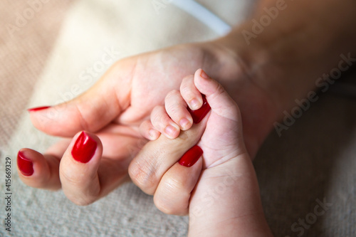 Fotografia Close up of mother and child hands, love and security