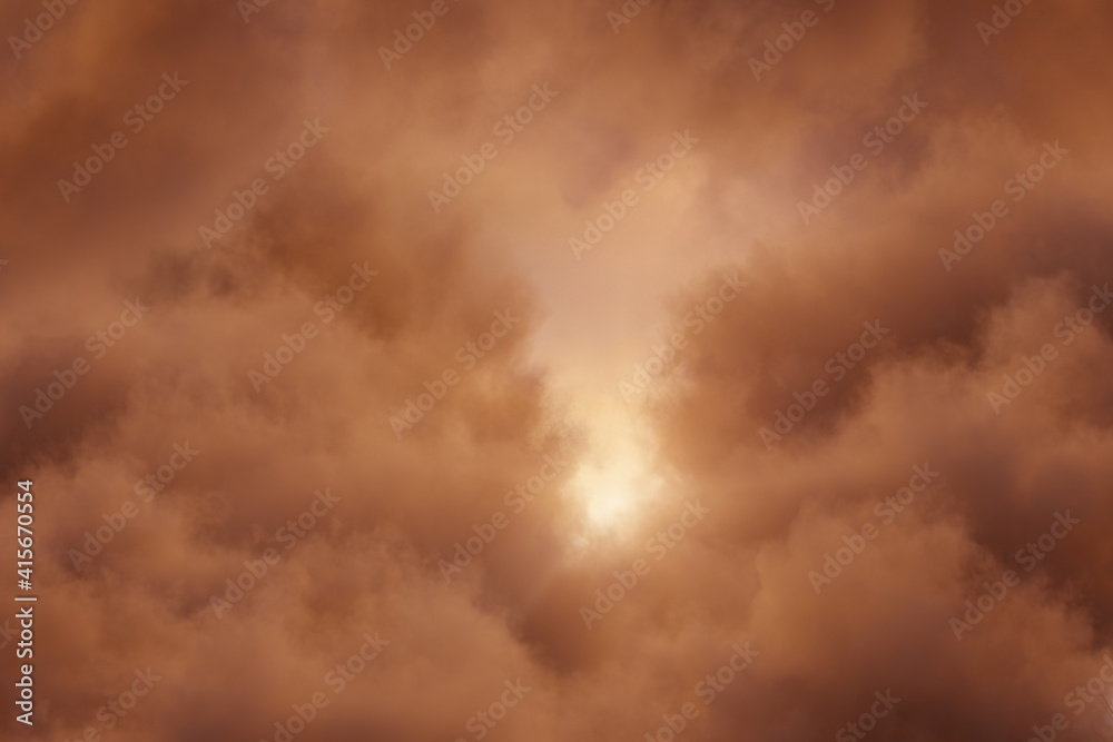 dramatic clouds in the evening sky with bright sunlight in the middle dramatic clouds in the evening sky with bright sunlight in the middle