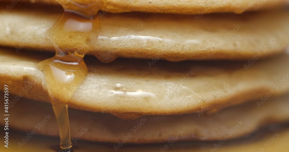 Pancakes and maple syrup macro slow motion 4K