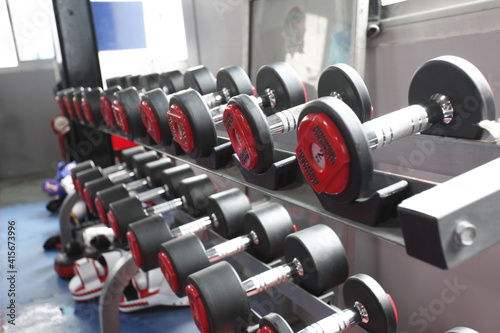 dumbbell weights on a shelf