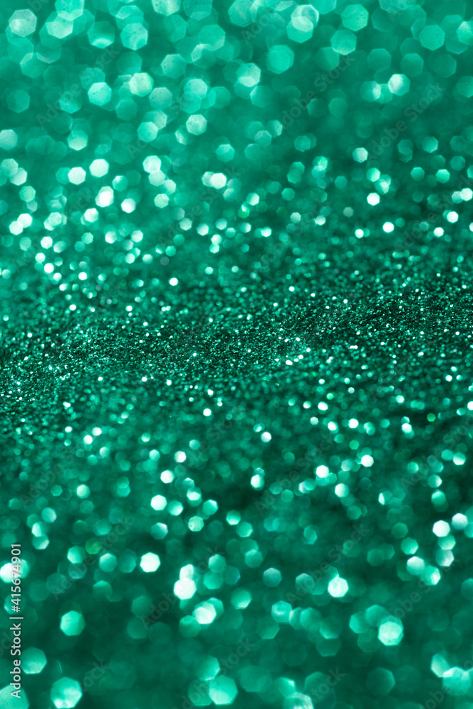 Green glitter texture. Festive background. Color sparkles. Abstract Christmas. Green glitter texture. Festive background. Color sparkles. Abstract Christmas.
