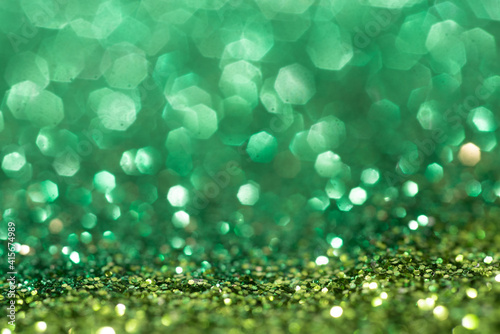 Green spring sparkle background. Colorful sparkles. Abstract advertising.