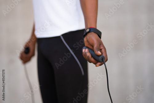 Athletic man doing exercise outdoors.