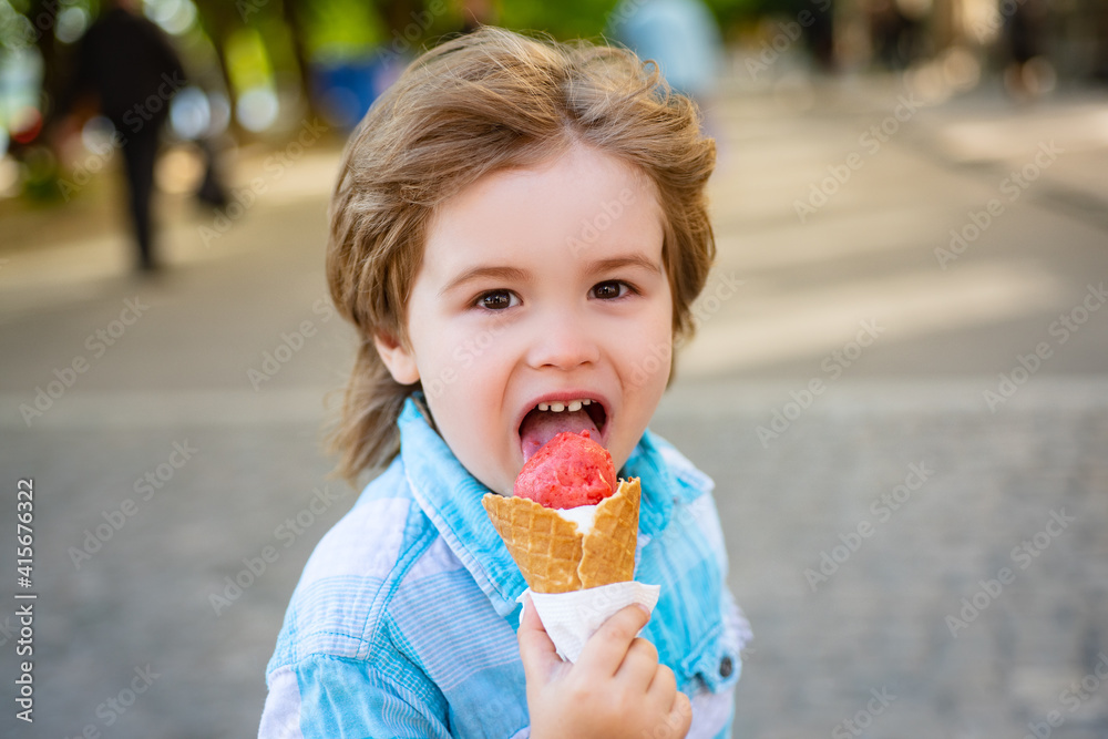 Boy eats ice-cream outdoor. Kids junk food. Delicious summer snacks. Ice cream. Boy eats ice-cream outdoor. Kids junk food. Delicious summer snacks. Ice cream.