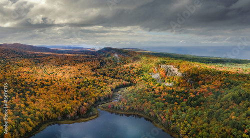 Fototapeta Naklejka Na Ścianę i Meble -  Gorgeous streaming sun during autumn day at Lake of the Clouds at the Porcupine Mountains Wilderness State Park in the Michigan Upper Peninsula